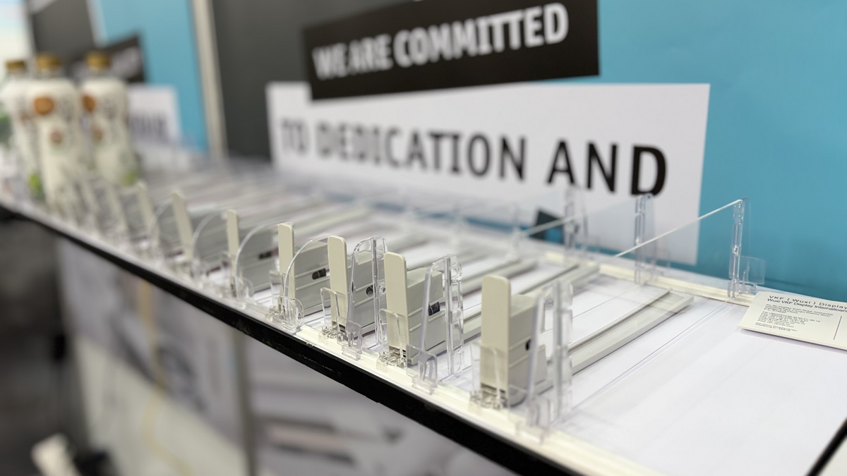 Shelf pusher system for retail shelf management